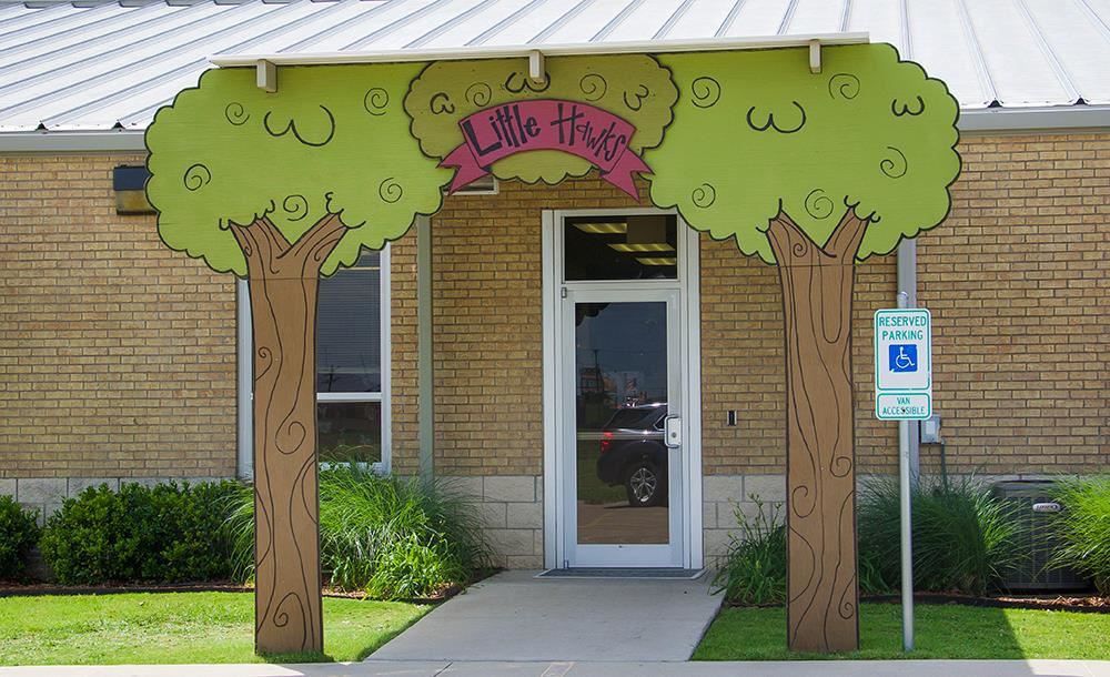 entrance to Little Hawks with graphical tree arch 
